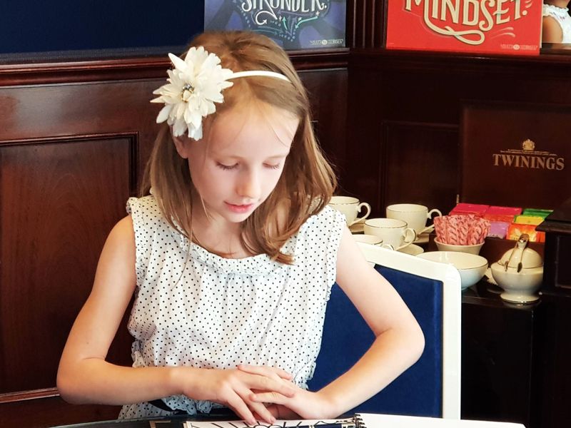 Child completing a leadership journal activity